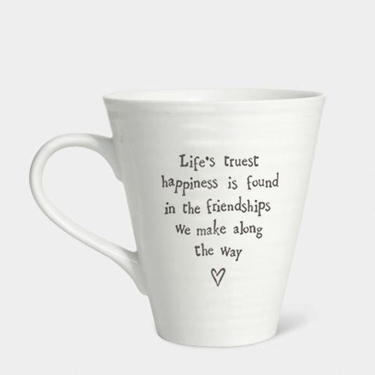 White mug with a quote on a white background