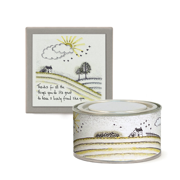 Decorative candle with matching artwork on a white background