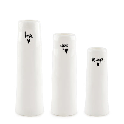 Three white vases with black text and heart symbols on a white background