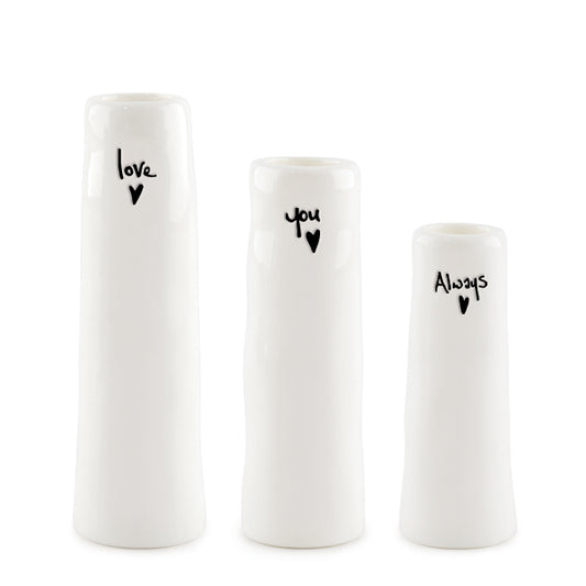 Three white vases with black text and heart symbols on a white background