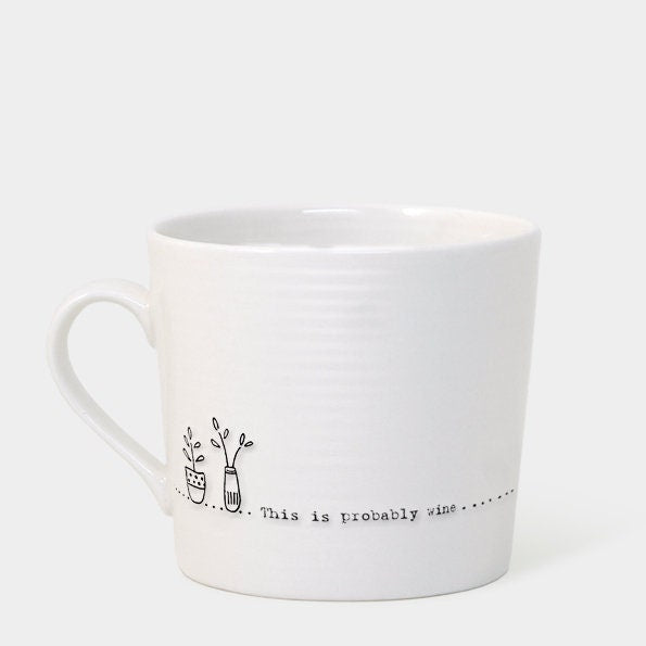 White mug with text on a beige box, brand 'East of India' visible White background.
