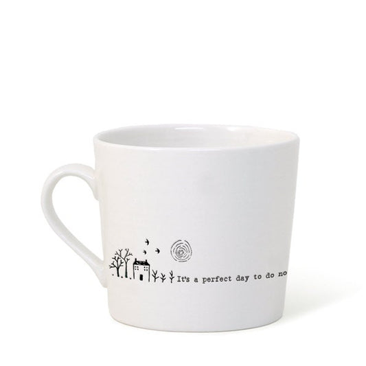 White mug with black text and design on a white background