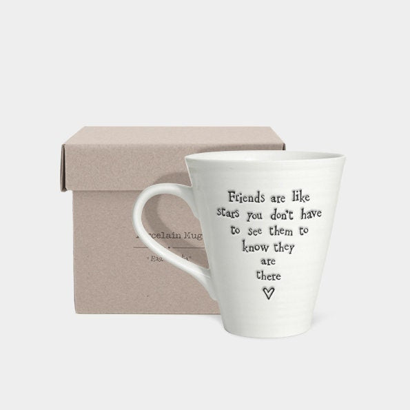 White mug with text in a box on a light gray background