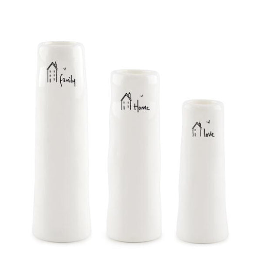 Three white vases with decorative text and on a white background