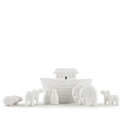 White ceramic Noah's ark with animals on a white background